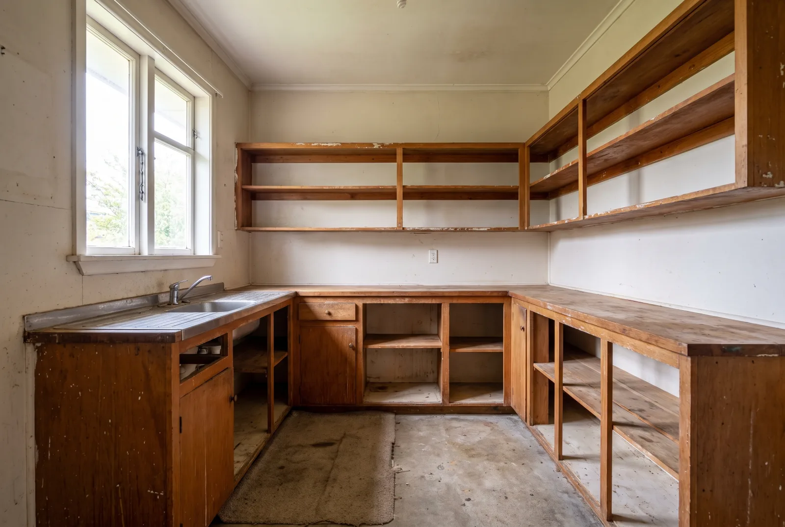 Inspector's clipboard staged at a basement wall before an estate cleanout survey